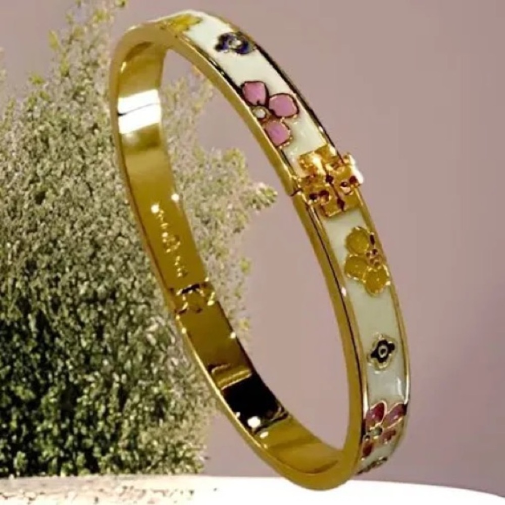Authentic Tory Burch New/tag and pouch. Enamel Floral Hinge gold tone bracelet.